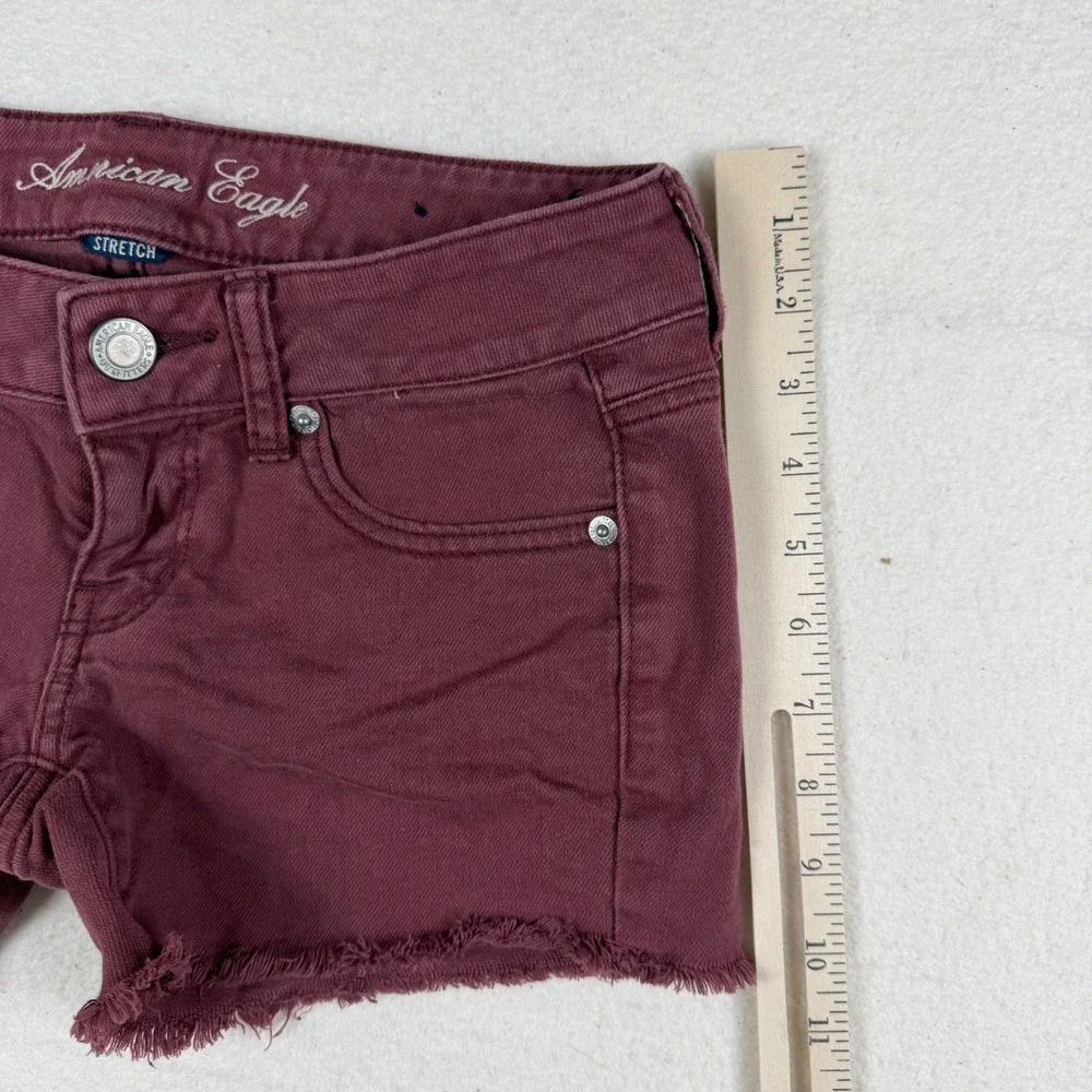 American Eagle Stretch Denim Shorts Burgundy Maroon Frayed Hem Size 0 Low Rise